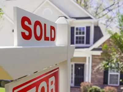 House with sold sign