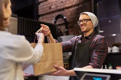 barrista serving customer