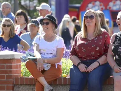 alt="people enjoying an outdoor event"
