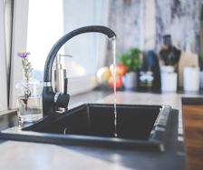 Water flowing from a tap at home