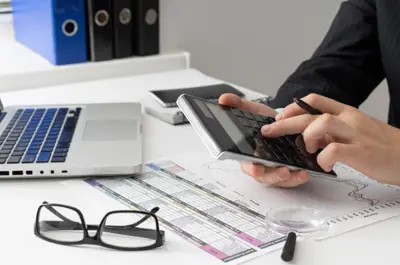 a man using a calculator