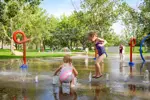alt="Children playing in splash park"