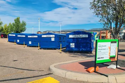 bulk recycling bins in a parking lot