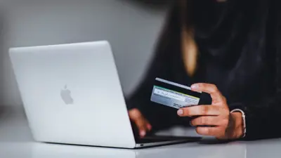 paying a bill on a laptop computer