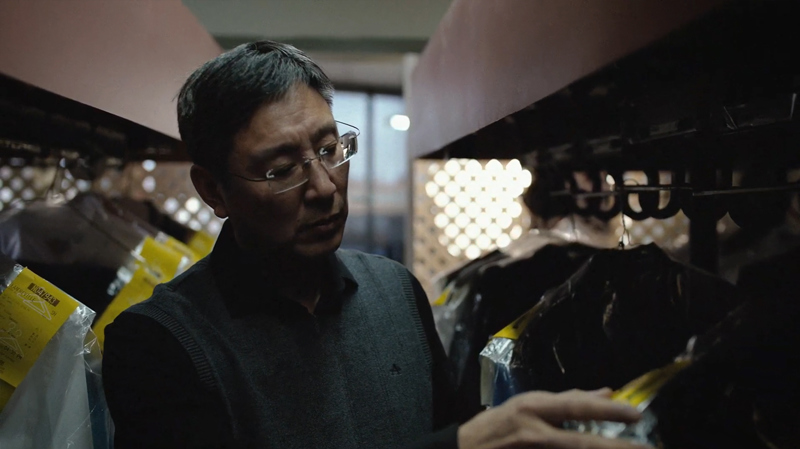 James Lu inside dry-cleaners