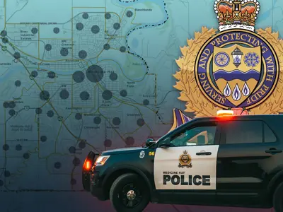 alt="Medicine Hat Police Logo over gradiant blue background"