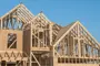 alt="a house under construction"